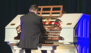 Photo of organist Ken Double at the console of the newly rebuilt Wurlitzer theater organ at the Lucas Theatre in Savannah, Georgia.